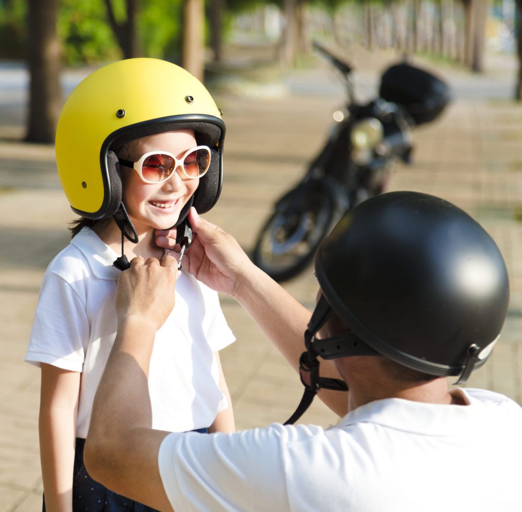 Father,Trying,To,Wear,A,Bike,Helmet,To,His,Daughter